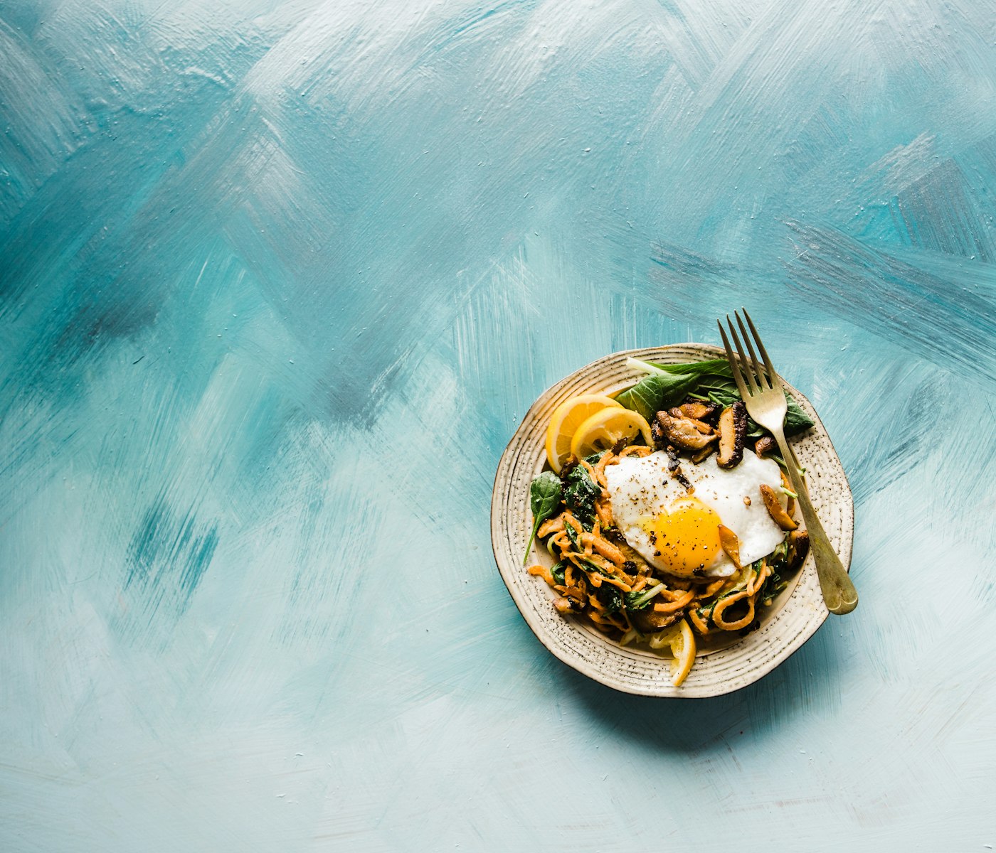 Fried eggs, greens & chilli butter